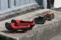 Shoes on the step to the front door.