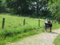 Holy moly, Christine is not riding the bike! --- Step hills and rough roads forced us both to push our bikes.